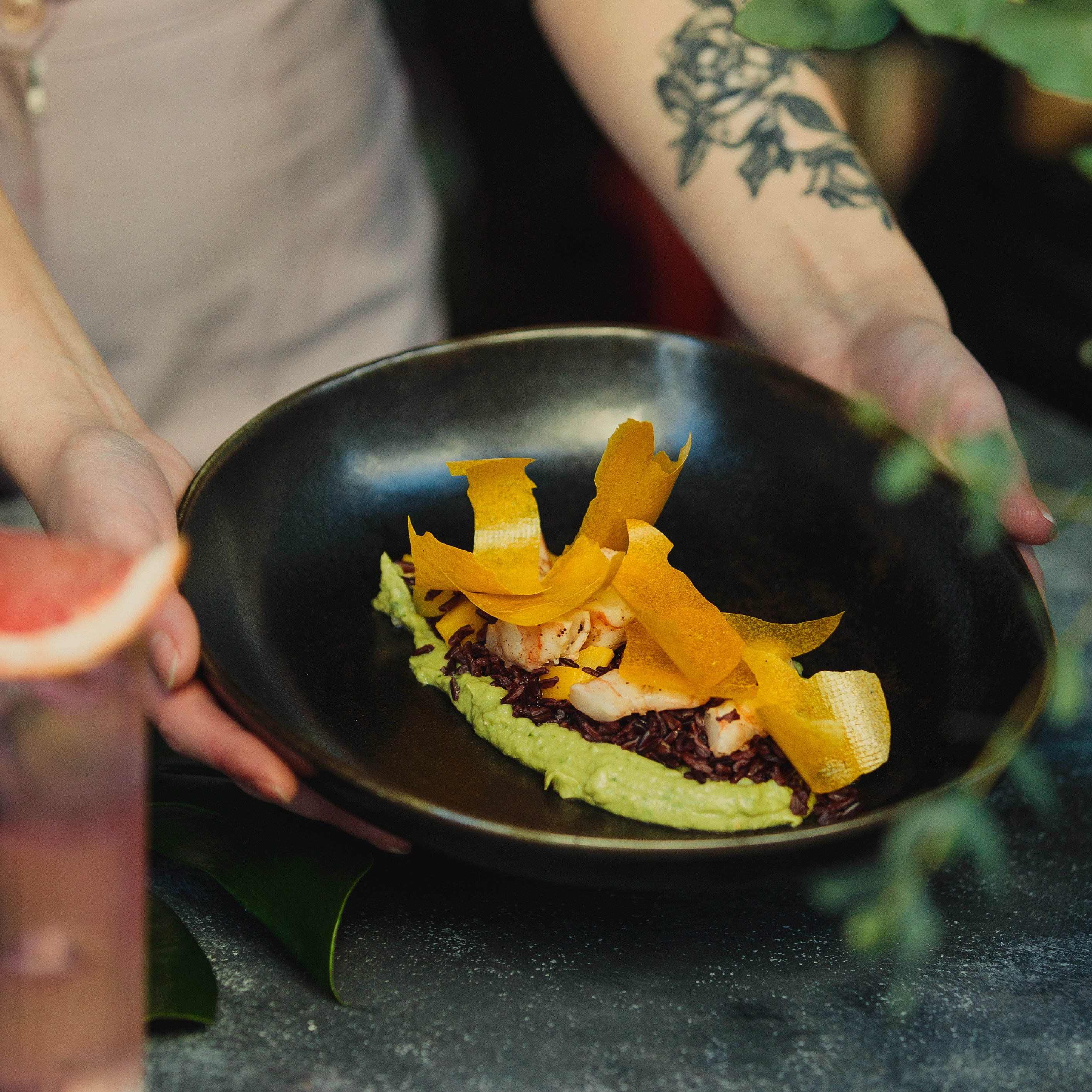 Chef plating a premium dish